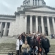 Porsche (L, middle row) is pictured with TeamChild staff and Youth Advisory Board members on the steps of the capitol building in Olympia.